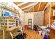 Cluttered storage room with exposed wood beams, filled with various household items at 609 3Rd Ave. N, Myrtle Beach, SC 29577