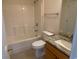 Bright bathroom featuring a tub and shower combination, granite countertop and tile flooring at 618 Cypress Dr., Surfside Beach, SC 29575