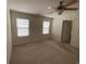 Bedroom featuring neutral carpet, ceiling fan, and two bright windows at 618 Cypress Dr., Surfside Beach, SC 29575