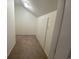 Walk-in closet with neutral carpet and white walls at 618 Cypress Dr., Surfside Beach, SC 29575