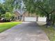 Charming brick home featuring an attached garage and a well-manicured lawn at 618 Cypress Dr., Surfside Beach, SC 29575