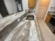 Close-up of kitchen counter with marbled granite and stainless steel sink at 618 Cypress Dr., Surfside Beach, SC 29575