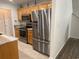 Kitchen with stainless steel refrigerator, microwave, and oven and wood cabinets at 618 Cypress Dr., Surfside Beach, SC 29575