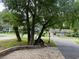 View of the quiet neighborhood street with mature trees at 618 Cypress Dr., Surfside Beach, SC 29575