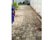 Paver walkway along a white fence with landscape lighting at 618 Cypress Dr., Surfside Beach, SC 29575