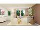 Living space with stylish decor including a grey couch, warm accents, and a view of the outside at 6328 Swainson Street Sw, Ocean Isle Beach, NC 28469