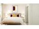 Stylishly decorated bedroom with comfortable bed, modern art, and ample natural light at 6331 Swainson Street Sw, Ocean Isle Beach, NC 28469