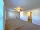 Spacious bedroom with neutral carpet, a ceiling fan and an ensuite bathroom at 6619 Colonial Dr., Myrtle Beach, SC 29572