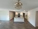 Open concept kitchen with granite countertops, white cabinets and stainless steel appliances at 6619 Colonial Dr., Myrtle Beach, SC 29572