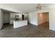 Open kitchen boasts white cabinets, granite countertops, stainless appliances and an island with sink at 6619 Colonial Dr., Myrtle Beach, SC 29572