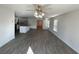 Open concept living room features light-colored walls and floors, and modern ceiling fan at 6619 Colonial Dr., Myrtle Beach, SC 29572