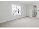Bedroom with neutral carpet, arched doorway and natural light at 6850 Belancino Blvd., Myrtle Beach, SC 29579
