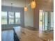 Dining area with modern lighting, granite countertops and sliding glass doors at 6850 Belancino Blvd., Myrtle Beach, SC 29579
