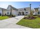Beautiful single-story home featuring a well-manicured lawn, inviting entrance, and a spacious driveway at 6850 Belancino Blvd., Myrtle Beach, SC 29579