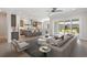 Open concept living room with kitchen, dining area, and view of outdoor patio at 6850 Belancino Blvd., Myrtle Beach, SC 29579
