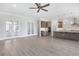 Open concept living room with tiled floors, ceiling fan and flow to the kitchen at 6850 Belancino Blvd., Myrtle Beach, SC 29579
