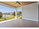 Cozy covered porch with wood ceiling and tile flooring, providing a relaxing outdoor space at 6850 Belancino Blvd., Myrtle Beach, SC 29579