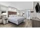 Comfortable bedroom with wood-look floors and sleek, modern furnishings at 6900 N Ocean Blvd. # 834, Myrtle Beach, SC 29577