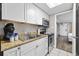 Efficient kitchen features white cabinetry, stainless steel appliances, and granite countertops at 6900 N Ocean Blvd. # 834, Myrtle Beach, SC 29577