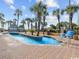 Close-up of community lazy river pool with tropical plants, floats, and zero entry at 6900 N Ocean Blvd. # 834, Myrtle Beach, SC 29577