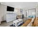 Inviting condo living room with modern furnishings, television, and ocean view at 6900 N Ocean Blvd. # 834, Myrtle Beach, SC 29577