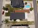 Aerial view showcasing a home with a pool, manicured yard, and stylish outdoor living space at 710 S Waccamaw Dr., Garden City Beach, SC 29576