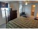 Well-lit bedroom with neutral tones, en-suite bathroom, and ample natural light at 710 S Waccamaw Dr., Garden City Beach, SC 29576
