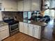 Kitchen with stainless steel appliances and open floor plan to dining area at 710 S Waccamaw Dr., Garden City Beach, SC 29576