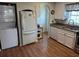 Kitchen with stainless steel appliances and laundry unit at 710 S Waccamaw Dr., Garden City Beach, SC 29576