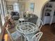 Cozy living room featuring comfortable seating and natural light with a round dining table at 710 S Waccamaw Dr., Garden City Beach, SC 29576