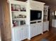 Built-in shelving with TV and storage in living room at 710 S Waccamaw Dr., Garden City Beach, SC 29576