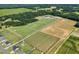 Expansive aerial view of the property, featuring well-maintained pastures, barns, and a charming residence at 7356 Johnson Shortcut Rd., Conway, SC 29527