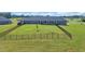 Fenced backyard with a lush green lawn, offering privacy and space for outdoor activities and relaxation at 7356 Johnson Shortcut Rd., Conway, SC 29527