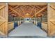 Interior view of a horse barn featuring wooden stalls and metal bars at 7356 Johnson Shortcut Rd., Conway, SC 29527
