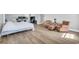 This bedroom has hardwood floors, nice furnishings, and large bright windows at 7356 Johnson Shortcut Rd., Conway, SC 29527