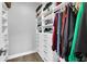 Organized walk-in closet with built-in shelves, drawers, and hanging rods for easy storage and access at 7356 Johnson Shortcut Rd., Conway, SC 29527