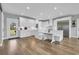 Bright, modern kitchen with white cabinetry, stainless steel appliances, and marble countertops, creating an inviting space at 7356 Johnson Shortcut Rd., Conway, SC 29527
