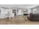 Open living space connecting the living room and modern kitchen, featuring stylish decor and an inviting atmosphere at 7356 Johnson Shortcut Rd., Conway, SC 29527