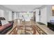 Spacious and bright living room with an open floor plan and a clear view into the modern, white kitchen at 7356 Johnson Shortcut Rd., Conway, SC 29527