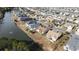 Aerial view showcasing homes in a waterfront community, with landscaped lawns at 755 Wintercreeper Dr., Longs, SC 29568