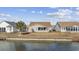 The backyard features a waterfront view, a playset, and an outdoor grill at 755 Wintercreeper Dr., Longs, SC 29568