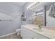 Light blue bathroom featuring a white vanity, large mirror, towel racks, and glass door shower with chrome fixtures at 755 Wintercreeper Dr., Longs, SC 29568