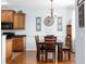 Dining nook with chandelier lighting, a wood table set, and views of the kitchen at 755 Wintercreeper Dr., Longs, SC 29568