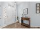 Inviting foyer with decorative wall art and a classic console table at 755 Wintercreeper Dr., Longs, SC 29568