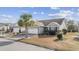Charming home with well-maintained lawn, features a Corvette logo on the driveway at 755 Wintercreeper Dr., Longs, SC 29568