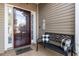 Cozy front porch with a decorative bench and a view of the home's exterior at 755 Wintercreeper Dr., Longs, SC 29568