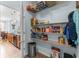 Pantry featuring shelving stocked with goods, and a view into the nearby kitchen at 755 Wintercreeper Dr., Longs, SC 29568