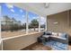 Relaxing screened porch offers water views, comfortable seating, and tranquil surroundings at 755 Wintercreeper Dr., Longs, SC 29568
