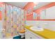 Bathroom with sink and colorful shower curtain, adding a playful touch to the space at 800 9Th Ave. S # N-1, North Myrtle Beach, SC 29582