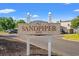 Attractive Sandpiper community sign with lush landscaping at 800 9Th Ave. S # N-1, North Myrtle Beach, SC 29582